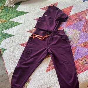 Figs Women's Top in Dark Purple with Orange Accent